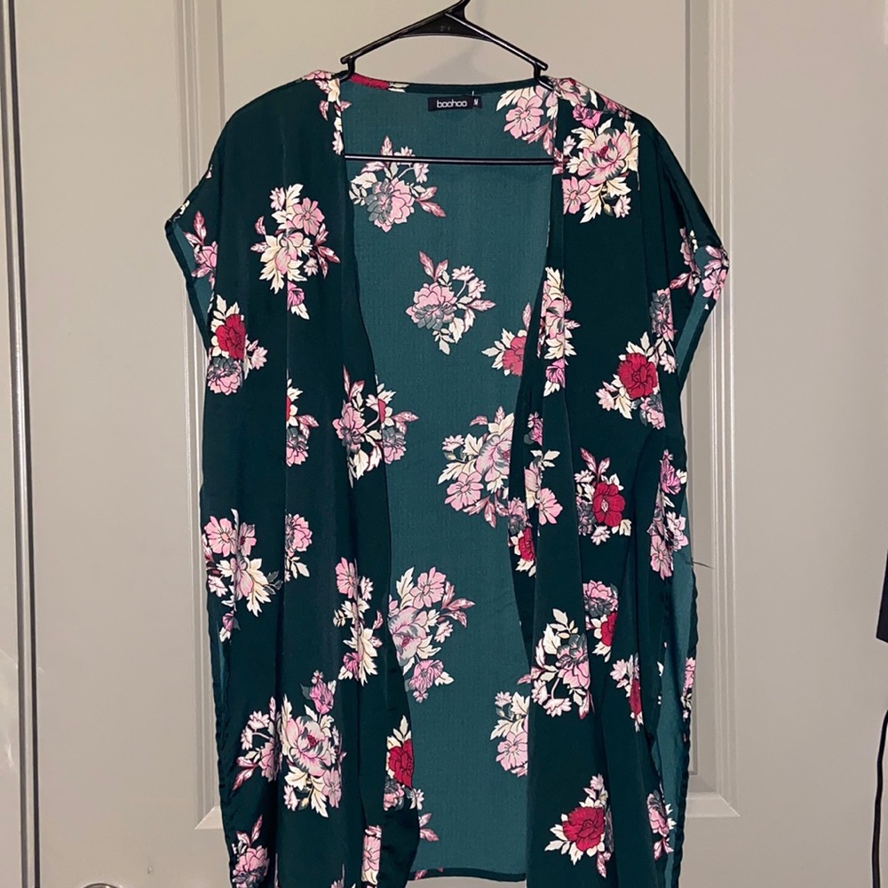 Short sleeveless green floral kimono. Great over swimsuits or with jeans!